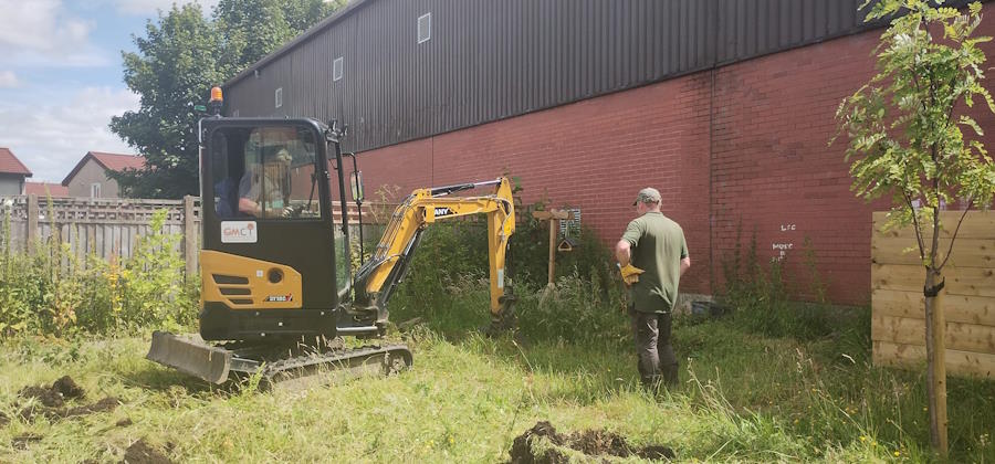 digging the pond in the  community garden